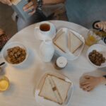 Children eating breakfast at a round table