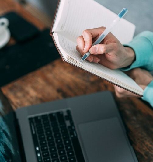 A person working at a desk with a laptop